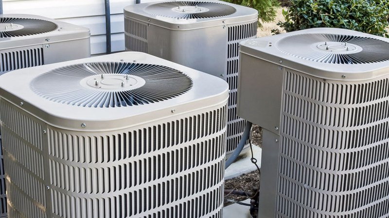 four outside AC units in need of professional air conditioning service