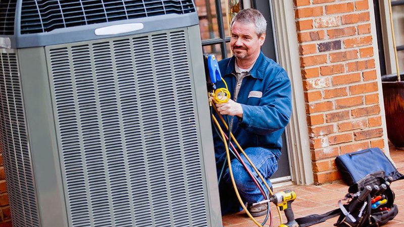air conditioning service master fixing an outside air conditioning unit